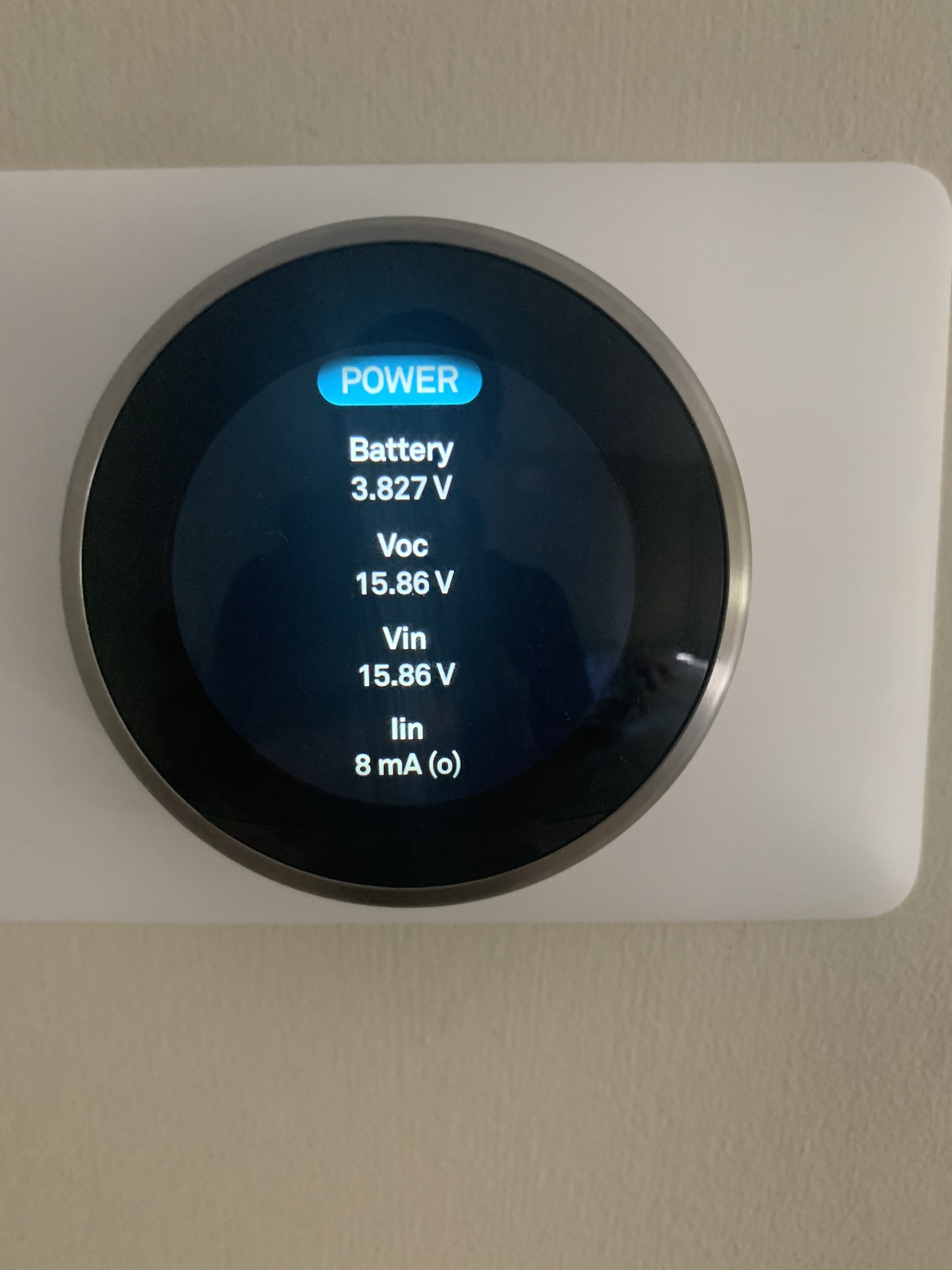 Alt Text: Image showing a Nest Thermostat displaying a 'Battery Low' warning on its screen