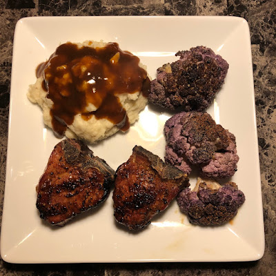 Grilled lamb loin chops, mashed potatoes and grilled purple cauliflower