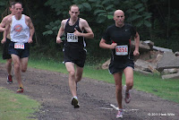 #6214 Michael Martinez (5th, 24:34), #2490 Nate Kaiser (2nd, 23:20), and #6351 Tony Guillen (6th, 24:50) midway through the first mile of the 2011 Potluck Four Mile.