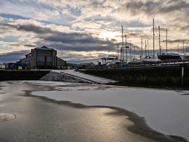 Photo of snow and ice on the water by the marina slipway