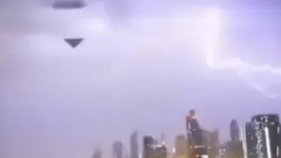 Small triangle shape UFO with a rectangular shape UFO during thunderstorm in Dubai UAE.