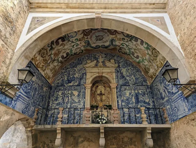 Arch covered in blue and white tiles in Obidos which is home to the Our Lady of Piety Oratory