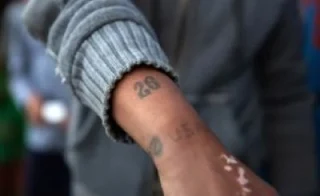 black man arm stamped with 26 and USA