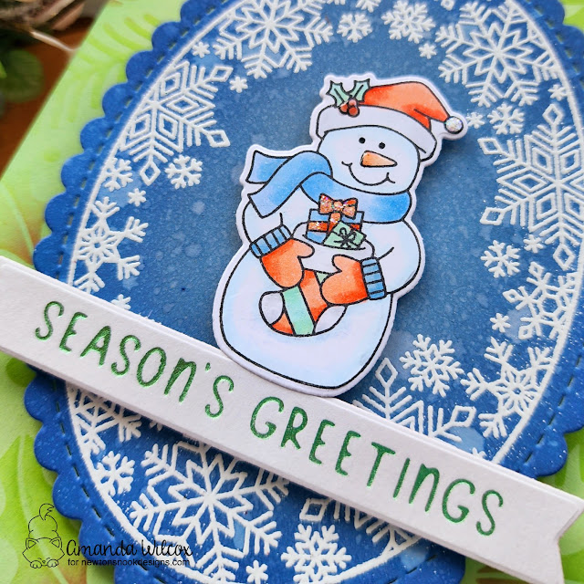 Season's Greetings Snowman Card by Amanda Wilcox | Snowman Greeting Stamp Set, Snowflake Oval Stamp Set, Oval Frames Die Set, Holiday Greetings Hot Foil Plates and Holiday Foliage Stencil by Newton's Nook Designs #newtonsnook #handmade