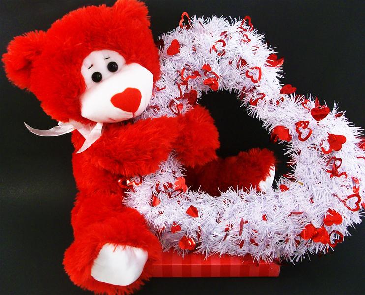 Valentine's Day Teddy Bear holding a heart Royalty Free Stock Vector Art