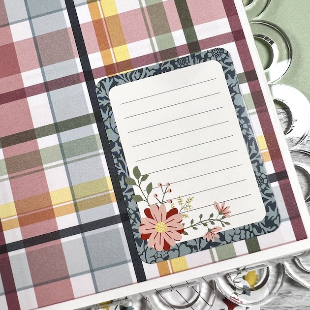 Spring scrapbook page with plaid paper & flowers in a scalloped acrylic album