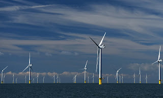 A wind farm off the coast of Sussex. (Photograph Credit: Mike Hewitt/Getty Images) Click to Enlarge.