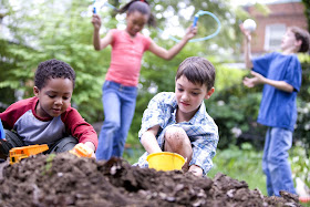 Picture of children playing in dirt