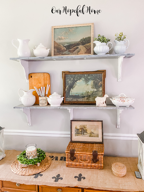 dining room farmhouse shelves with vintage paintings