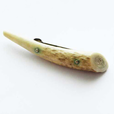 Horn antique brooch