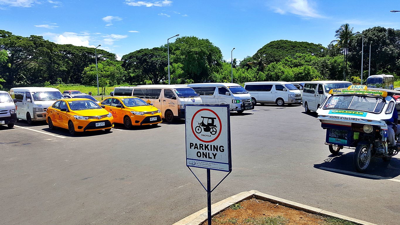 yellow taxi at parking area of Puerto Princesa International Airport