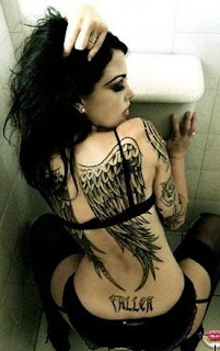 Wings of angel tattoo on female back body