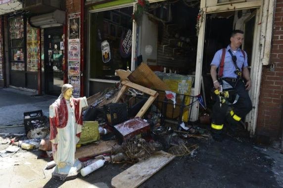 'Jesus' statue doesn't get burnt as firefighters retrieve debris from burning New York religious shop (photo)