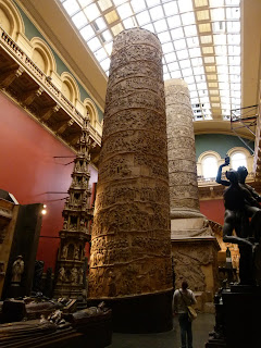 Tall column of plaster with figures in relief, a copy of Trajan's Column at the V&A, London