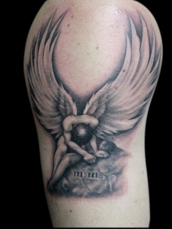 Large fallen angel tattoo on upper arm and shoulder.