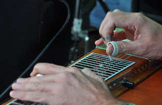 Close up of clide guitar being played
