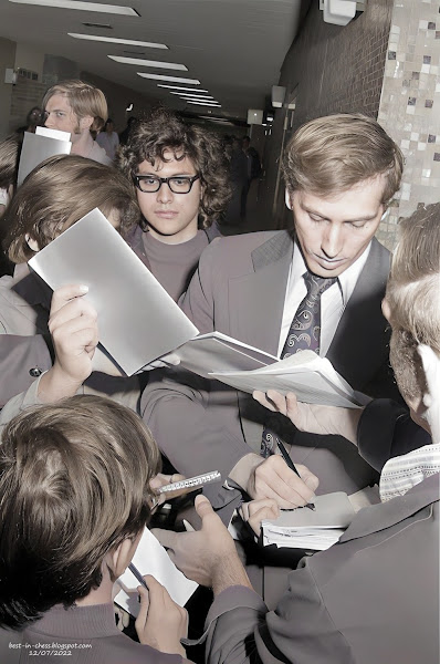 Chess Champ Signs Autographs--World chess champion Bobby Fischer stops for name signings outside the playing hall of the Church's International Chess tournament.