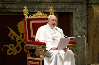 Pope reading a letter