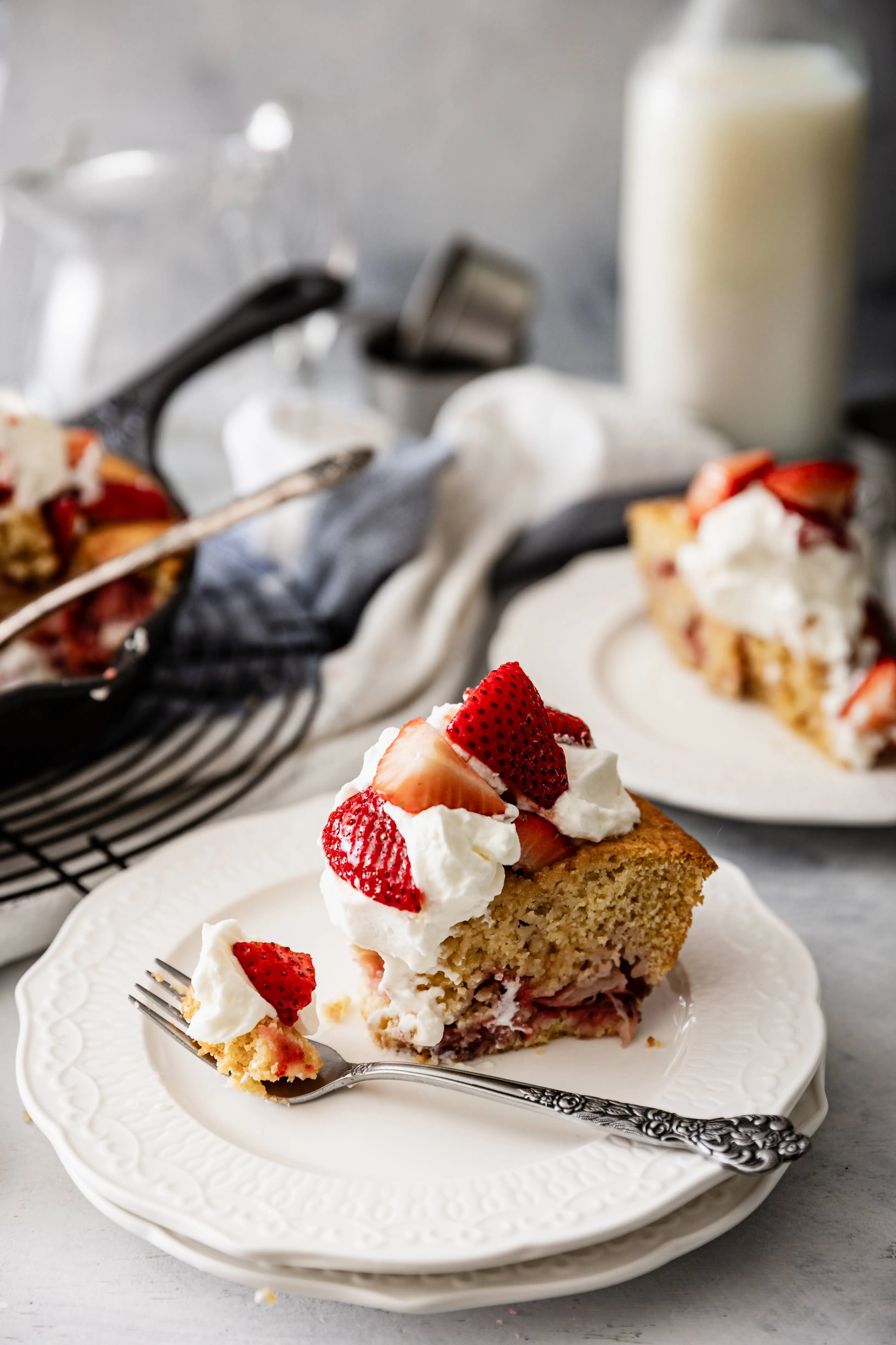 Strawberry Cornmeal Skillet Cake with Muddled Strawberries and Whipped Cream