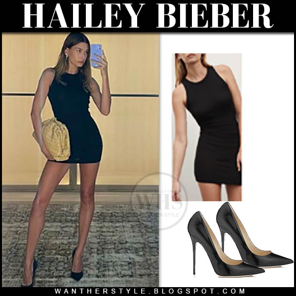 Hailey Bieber in black mini dress and black pumps
