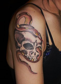 skull tattoo / snake tattoo