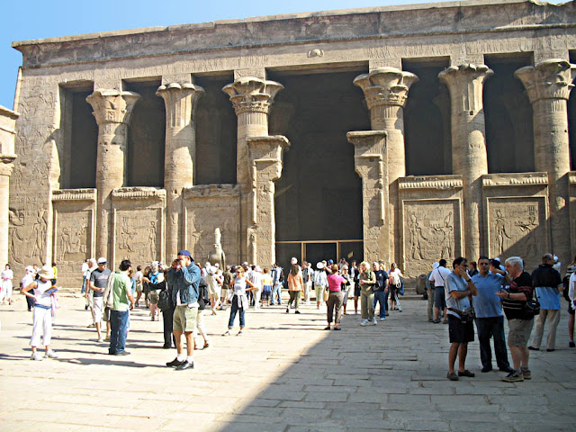 Tourists milling about outside the Edfu temple