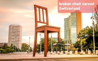 10 حقائق مذهلة عن سويسرا - منحوتة الكرسي المكسور  broken chair carved switzerland