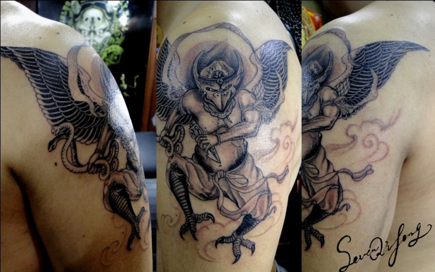 Demon Tattoo Designs black demon tattoo on the arm