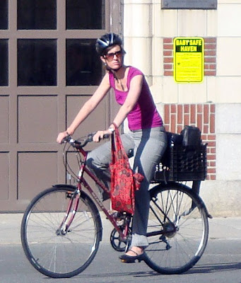 Lady cyclist bags rack