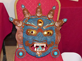 Traditional metal mask decorated with corals and turquoise, Nepal