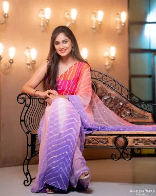 Tejaswini Gowda wearing a traditional saree, looking graceful and elegant in a sophisticated pose