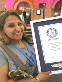 Holding the official Guinness World Records certificate 