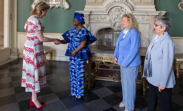Queen Mathilde wore a floral print silk crepe de Chine dress by Red Valentino. Sima Samar and Annie Matundu Mbambi