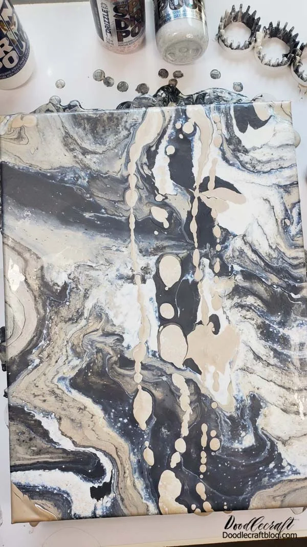 Okay, side note Natalie here.   I wasn't thrilled about how my pour looked right down the middle, so I added some more pour paint in veins right on top.   Then I let it all dry.