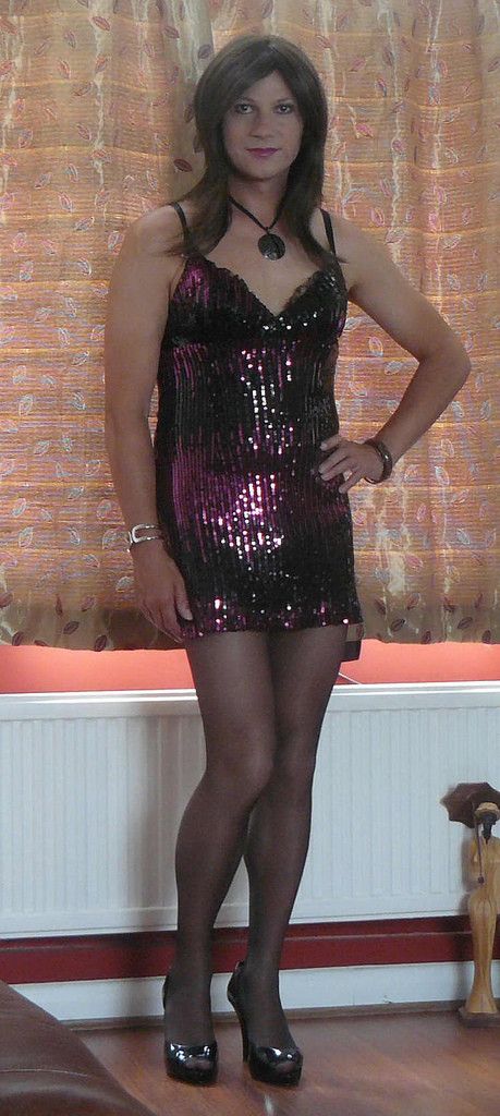 Sexy crossdresser in black pantyhose and high heels
