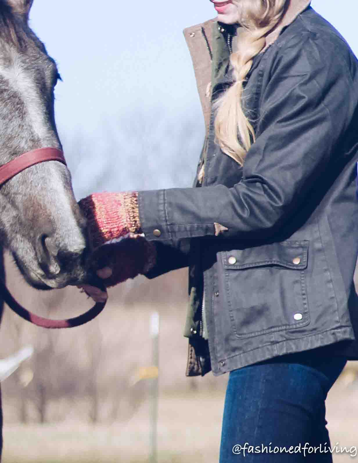 womens barn coat outfit with jeans and cowboy boots