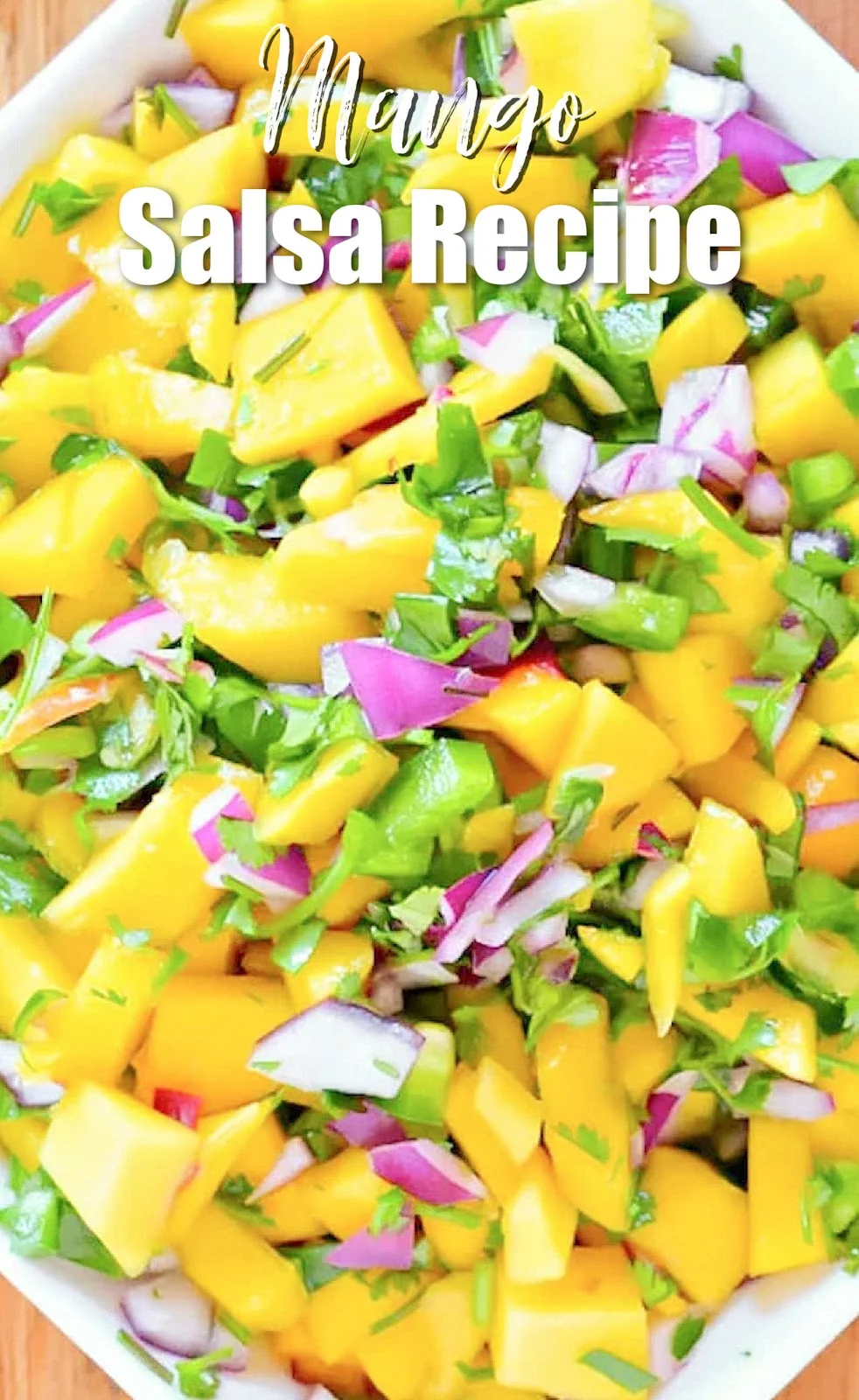 A down shot of Mango Salsa in a white bowl with white text at top of photo Mango Salsa Recipe.