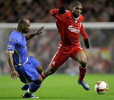 Portsmouth's Papa Bouba Diop is beaten to the ball by Ryan Babel of Liverpool during their Premier League match at Anfield in Liverpool, England