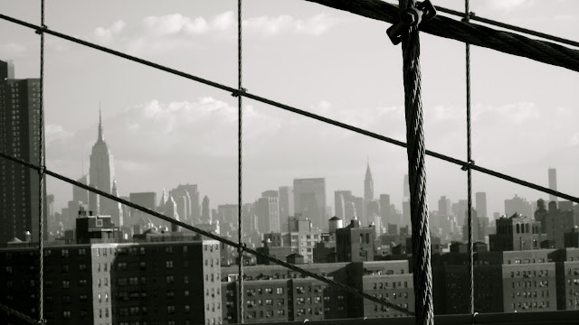 The Empire State and the Chrysler as seen from Brooklyn Bridge.