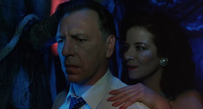 Julia (Clare Higgins) tempts the occult-obsessed Dr. Channard (Kenneth Cranham).