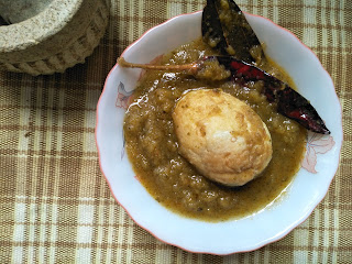 Egg curry in green tomato gravy 