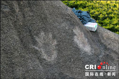 80-year-old Leaves His Palm Marks On A Rock.
