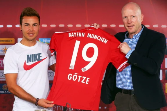 New Bayern Munich signing Mario Götze poses with sporting director Matthias Sammer