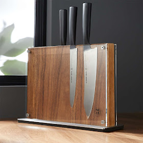 magnetized wood, upright, with an acrylic shield in front of the wood holding the knives