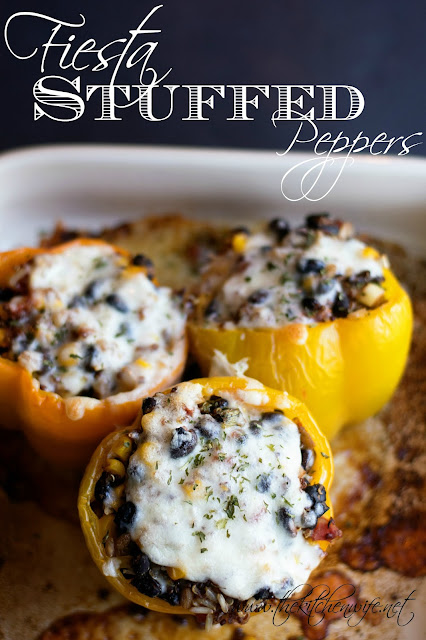 The finished Fiesta Stuffed Peppers, in the baking dish, with the title above it. 