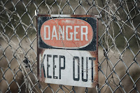 Danger Sign - Photo by Edwin Hooper on Unsplash