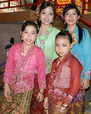 Looking pretty: Four young Nyonyas clad in vibrant kebaya and sarung at the Baba Nyonya Night at Jonker Street, recently.