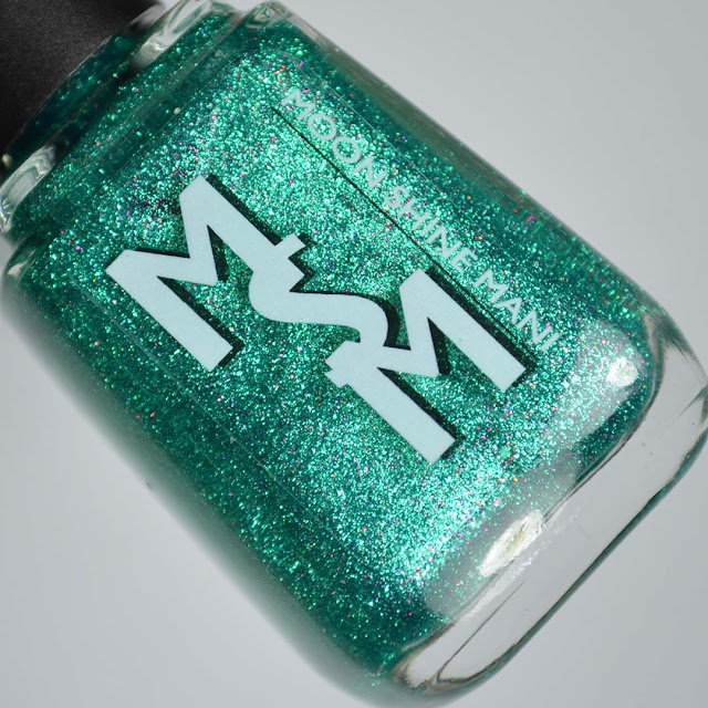 green glitter nail polish in a bottle