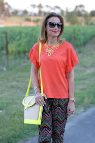 orange t-shirt, swaychic ehtnic printed pants, neon bucket bag, fashion and cookies