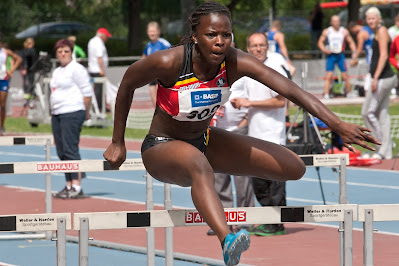 an athlete jumping a hurdle